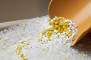 Plastic additive beads representing emerging plastic additive trends in modern manufacturing